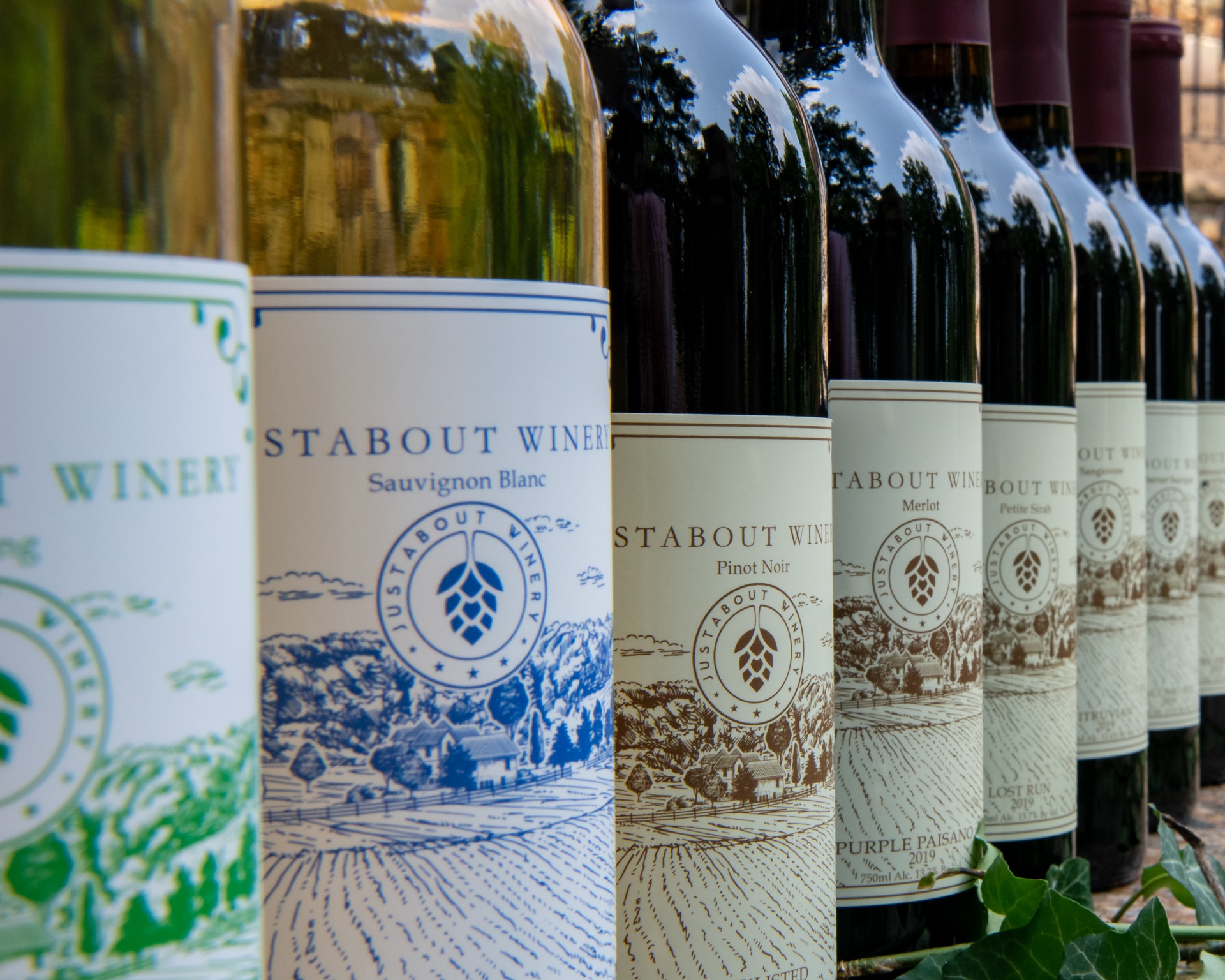 Justabout Winery wine bottles lineup closeup