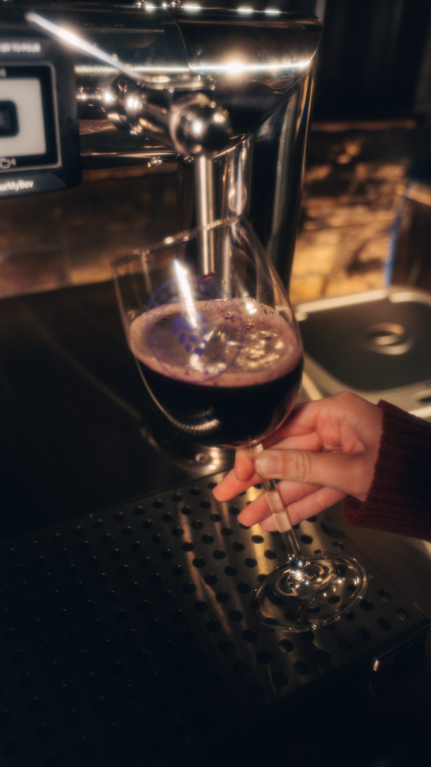 Winery wine on tap poured into glass